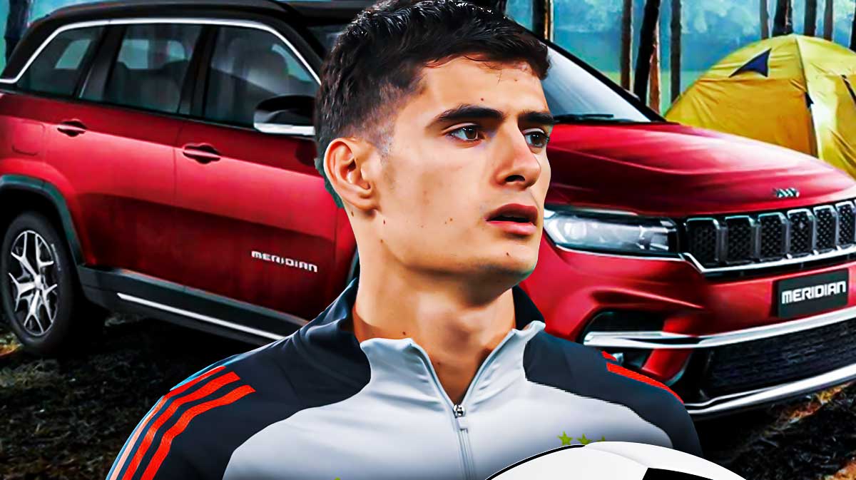 Antonio Silva in front of a car from his collection.