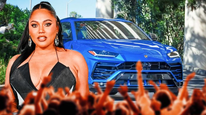 Ayesha Curry in front of a car from her collection.