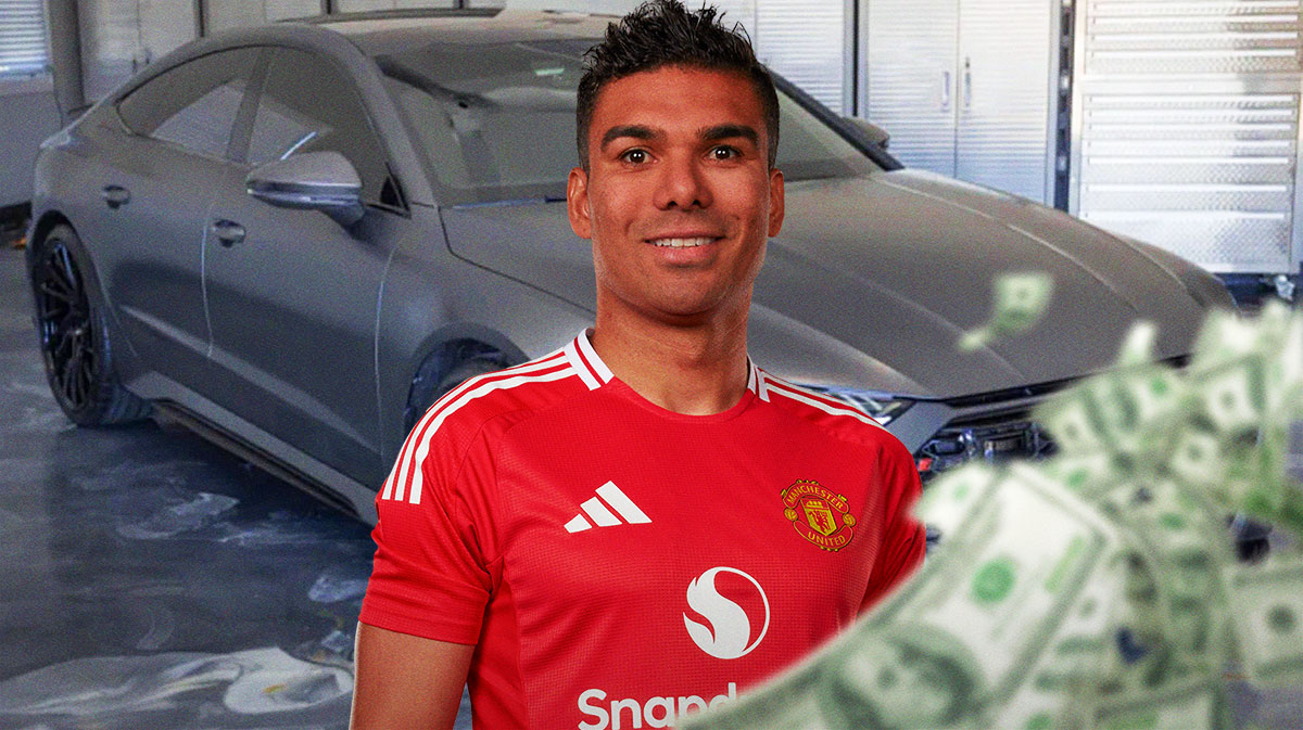 Casemiro in front of a car from his collection.