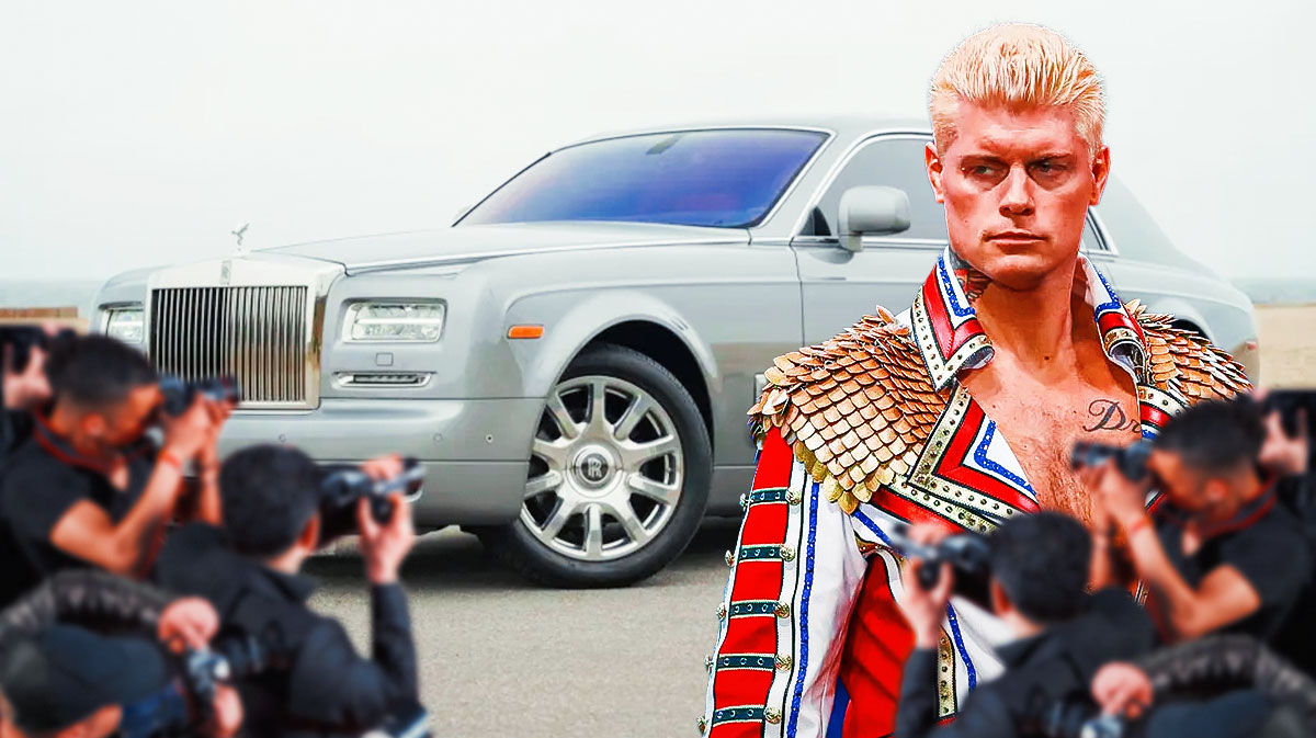 Cody Rhodes in front of a car from his collection.