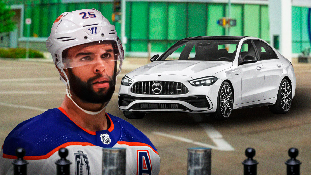 Darnell Nurse in front of a car from his collection.