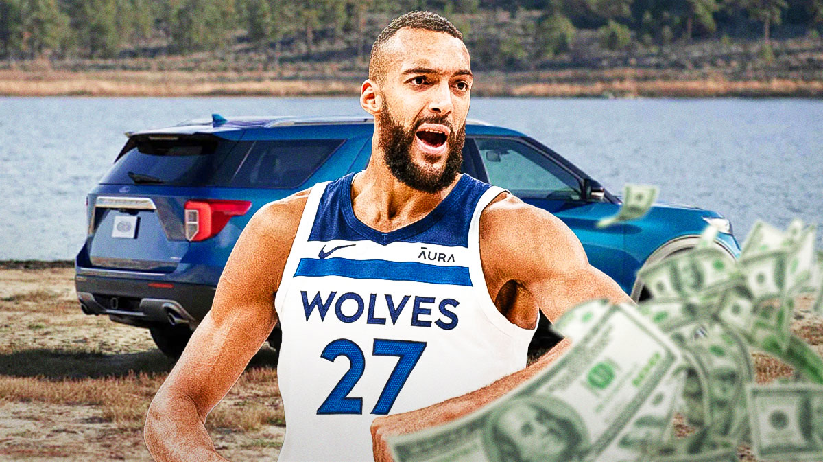 Rudy Gobert in front of a car from his collection.