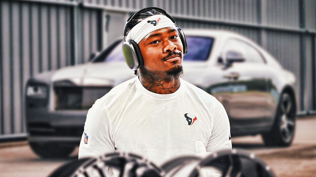 Stefon Diggs in front of a car from his collection.
