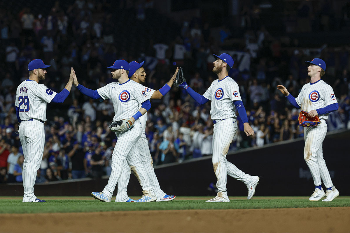 Chicago Cubs players celebrate after defeating the Washington Nationals at Wrigley Field.