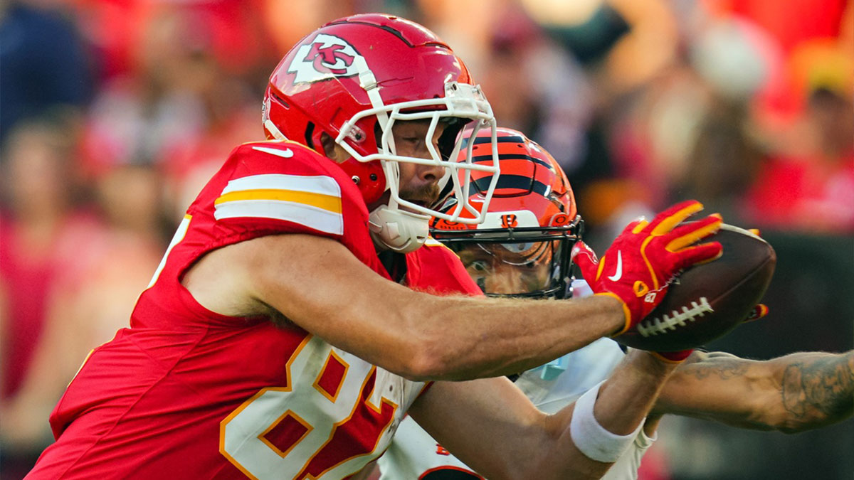 Kansas City Chiefs tight end Travis Kelce (87) catches a pass against Cincinnati Bengals safety Daijahn Anthony (33) during the second half at GEHA Field at Arrowhead Stadium.