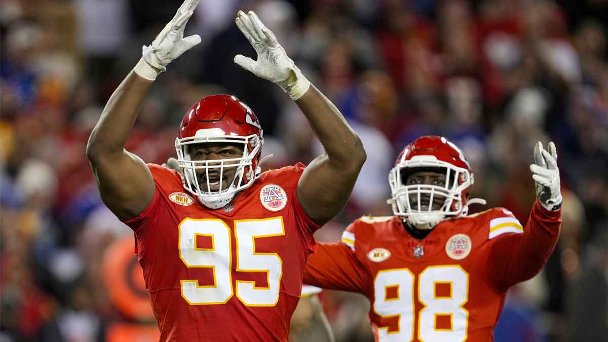 Kansas City Chiefs defensive tackle Chris Jones (95) and defensive tackle Tershawn Wharton (98) rally the crowd during the second half against the Buffalo Bills at GEHA Field at Arrowhead Stadium.