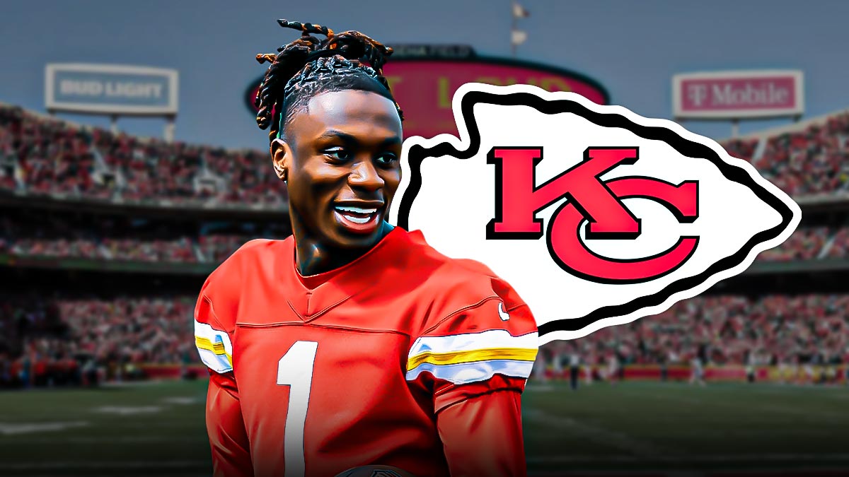 Chiefs' Xavier Worthy smiles next to Ravens players