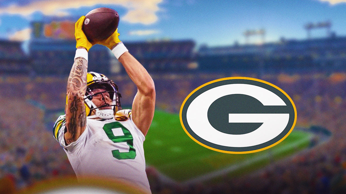 Christian Watson catching a pass next to a Packers logo