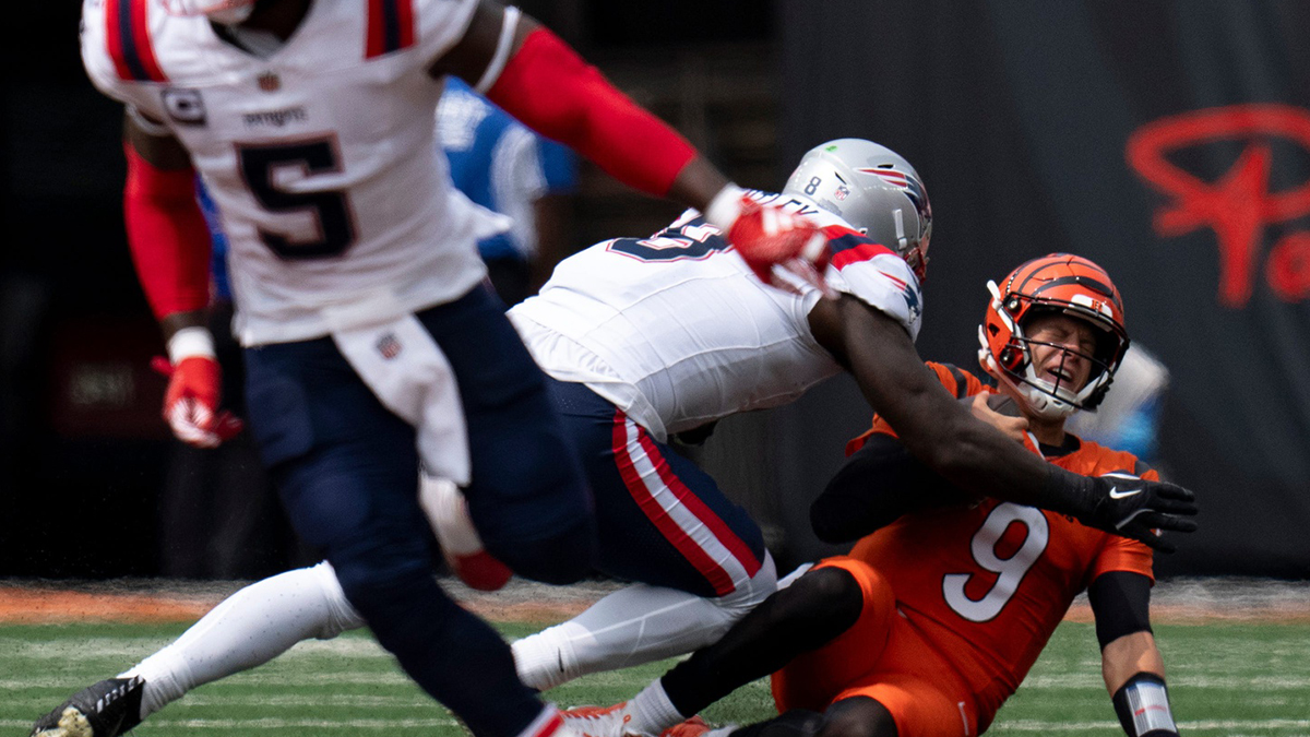 New England Patriots wide receiver Kayshon Boutte (9) hits Cincinnati Bengals quarterback Joe Burrow (9) in the second quarter of the NFL game at Paycor Stadium in Cincinnati on Sunday, Sept. 8, 2024.