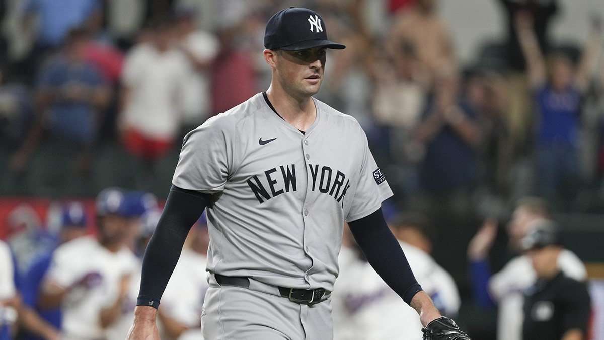 New York Yankees relief pitcher Clay Holmes (35) walks from the field after giving up a grand slam walk-off to Texas Rangers center fielder Wyatt Langford (not shown) during the ninth inning at Globe Life Field.