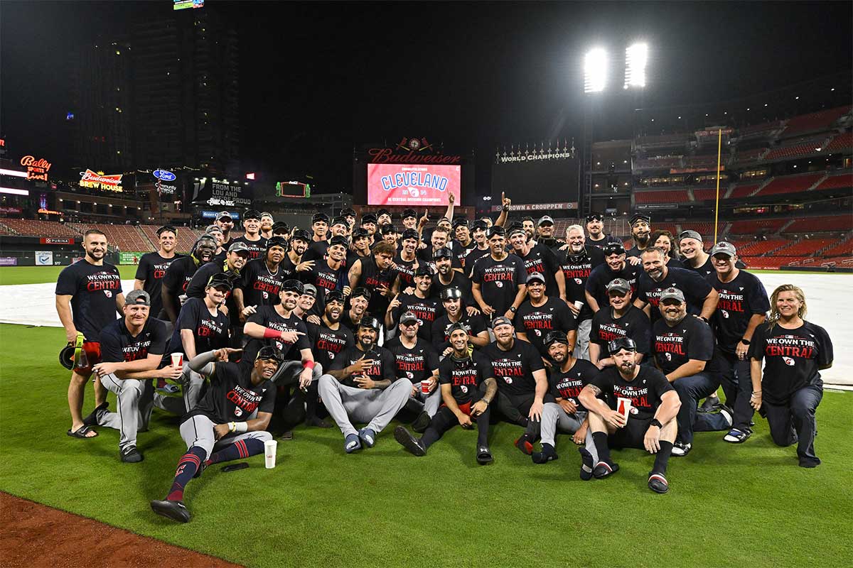 The Cleveland Guardians pose for a photo on the field after the Guardians clinched the AL central division title after a game against the St. Louis Cardinals at Busch Stadium.