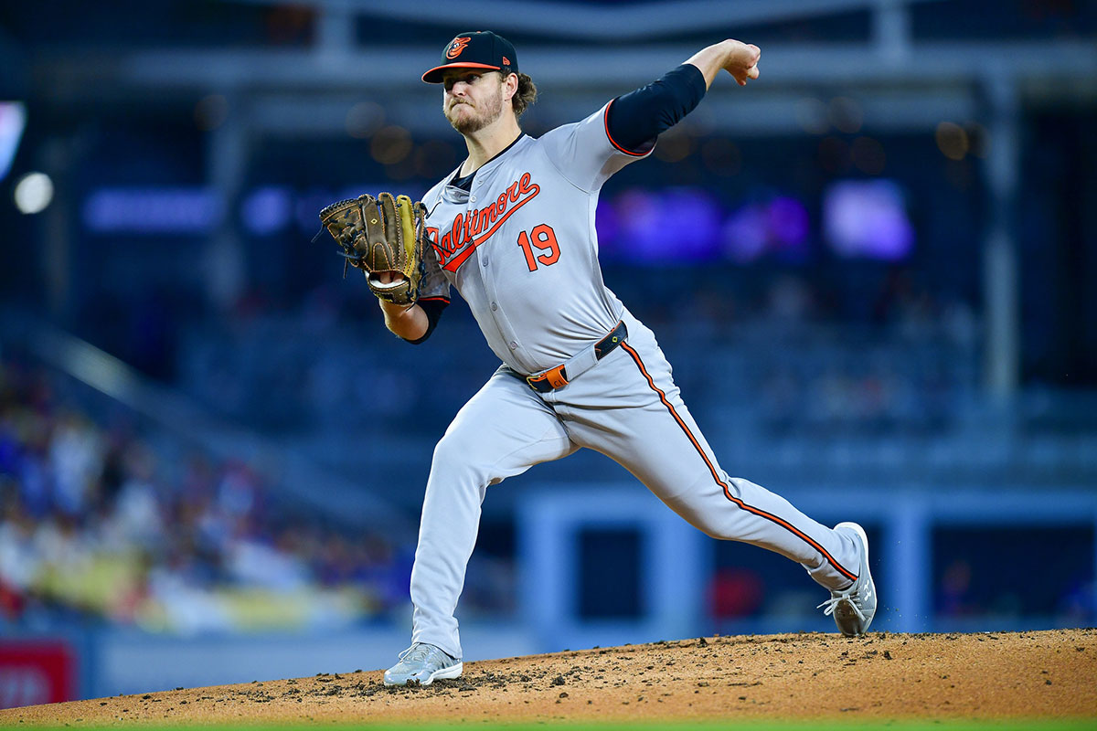 Baltimore Orioles pitcher Cole Irvin (19) throws against the Los Angeles Dodgers during the second inning at Dodger Stadium.