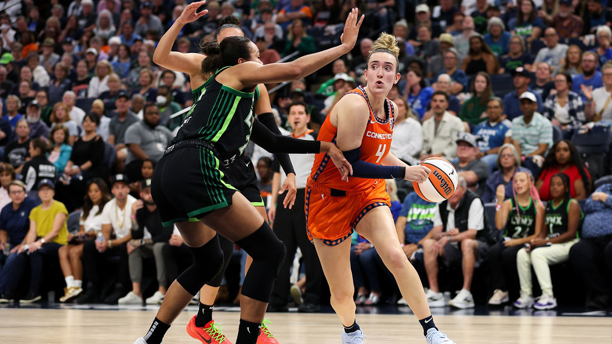 Connecticut Sun guard Marina Mabrey (4) works towards the basket as Minnesota Lynx forward Napheesa Collier (24) defends during the first half of game one of the 2024 WNBA Semi-finals