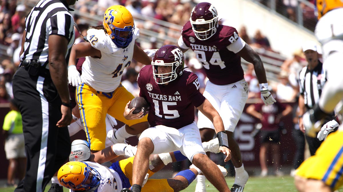 Texas A&M Aggies quarterback Conner Weigman (15) runs the ball against the McNeese State Cowboys during the second quarter at Kyle Field.