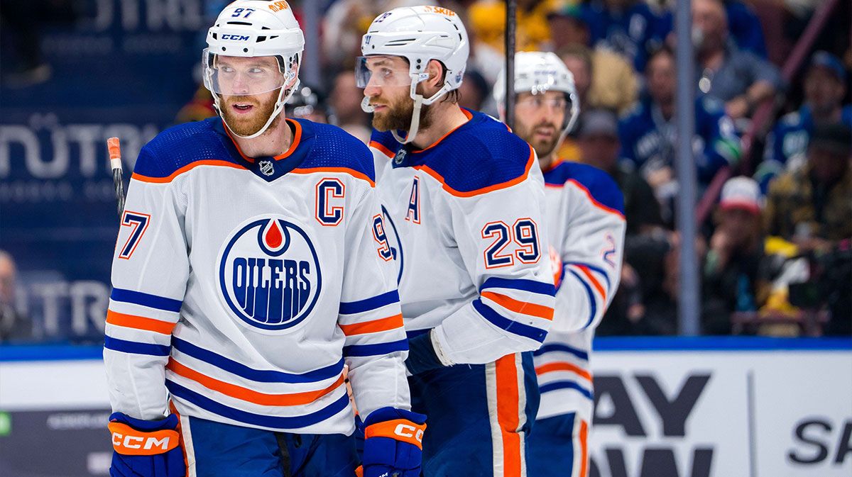 Edmonton Oilers forward Connor McDavid (97), forward Leon Draisaitl (29) and defenseman Evan Bouchard (2) during a stoppage in play against the Vancouver Canucks during the first period of Game 5 of the second round of the 2024 Stanley Cup Playoffs at Rogers Arena.