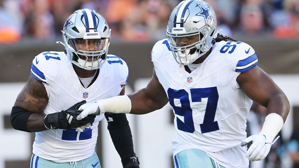 Dallas Cowboys linebacker Micah Parsons (11) celebrates with defensive tackle Osa Odighizuwa (97)