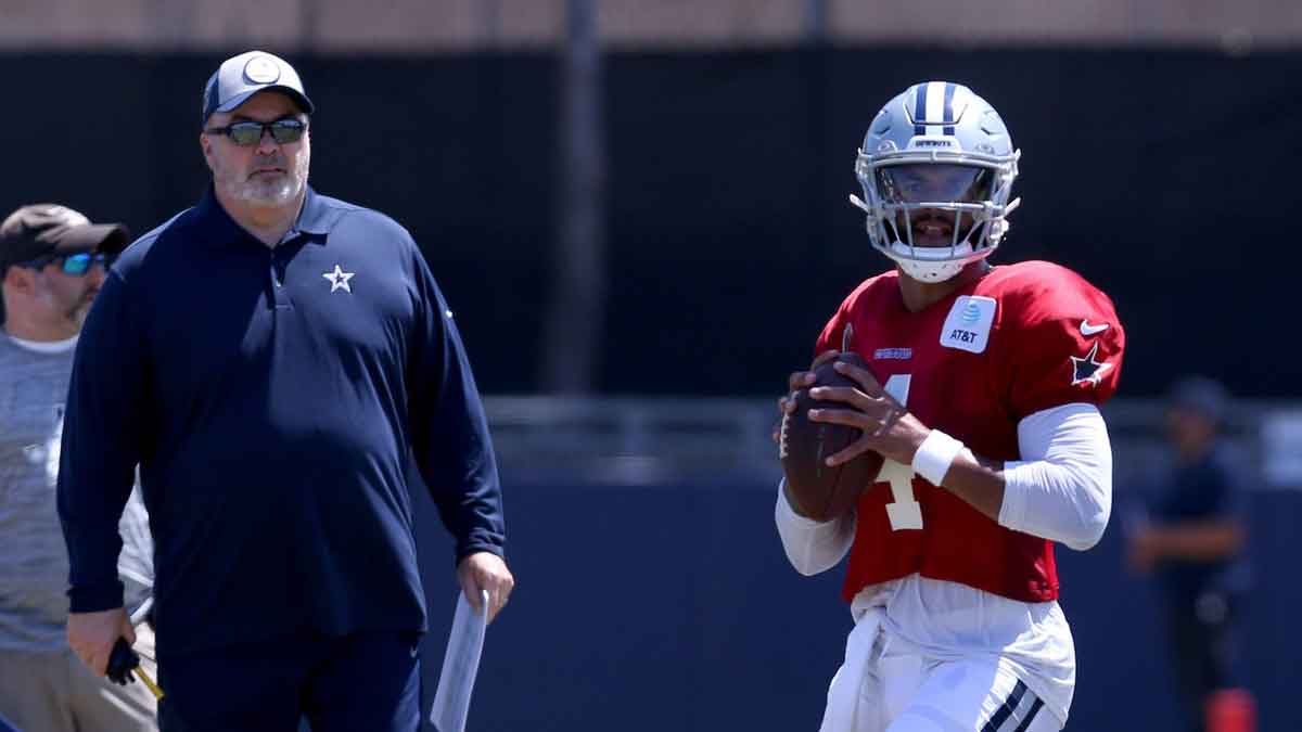 Dallas Cowboys head coach Mike McCarthy watches quarterback Dak Prescott (4) during training camp at the River Ridge Playing Fields in Oxnard, California. 