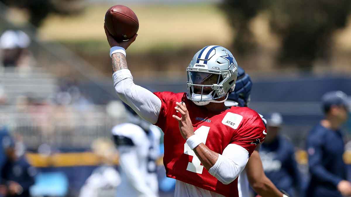 Dallas Cowboys quarterback Dak Prescott (4) throws during training camp at the River Ridge Playing Fields in Oxnard, California.