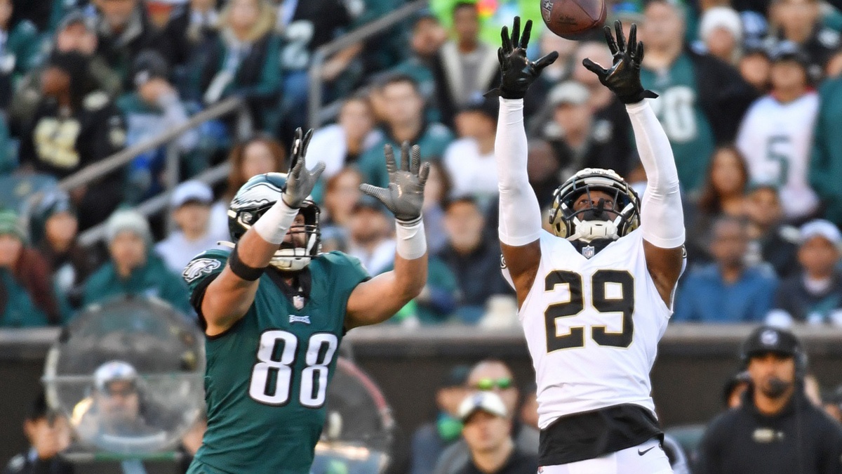 New Orleans Saints cornerback Paulson Adebo (29) breaks up pass intended for Philadelphia Eagles tight end Dallas Goedert (88) during the fourth quarter at Lincoln Financial Field.