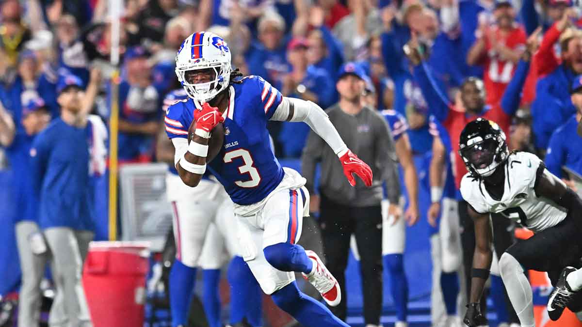 Sep 23, 2024; Orchard Park, New York, USA; Buffalo Bills safety Damar Hamlin (3) returns an interception against the Jacksonville Jaguars in the second quarter at Highmark Stadium. 