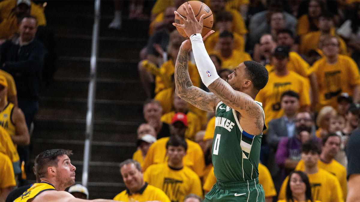 Milwaukee Bucks guard Damian Lillard (0) shoots the ball while Indiana Pacers guard T.J. McConnell (9) defends during game six of the first round for the 2024 NBA playoffs at Gainbridge Fieldhouse.