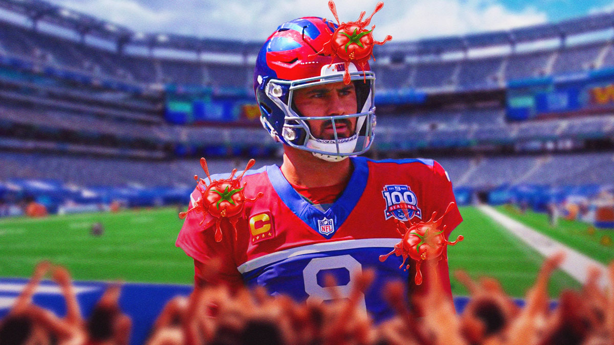 Daniel Jones in his Giants jersey looking sad/serious. can be surrounded by angry fans or maybe tomatoes being thrown at him on a Metlife Stadium background.