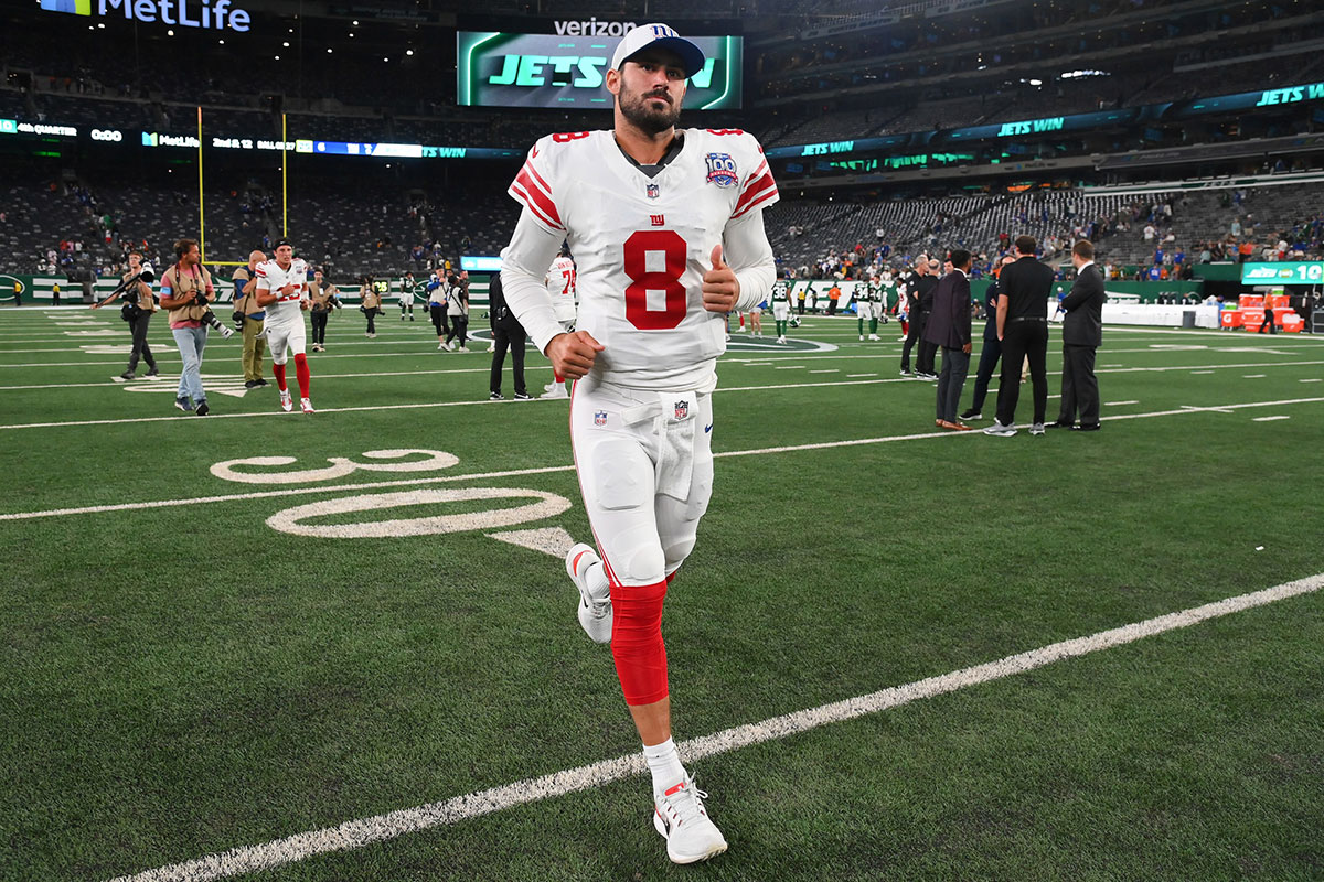 New York Giants quarterback Daniel Jones (8) jogs off the field following the game against the New York Jets at MetLife Stadium.