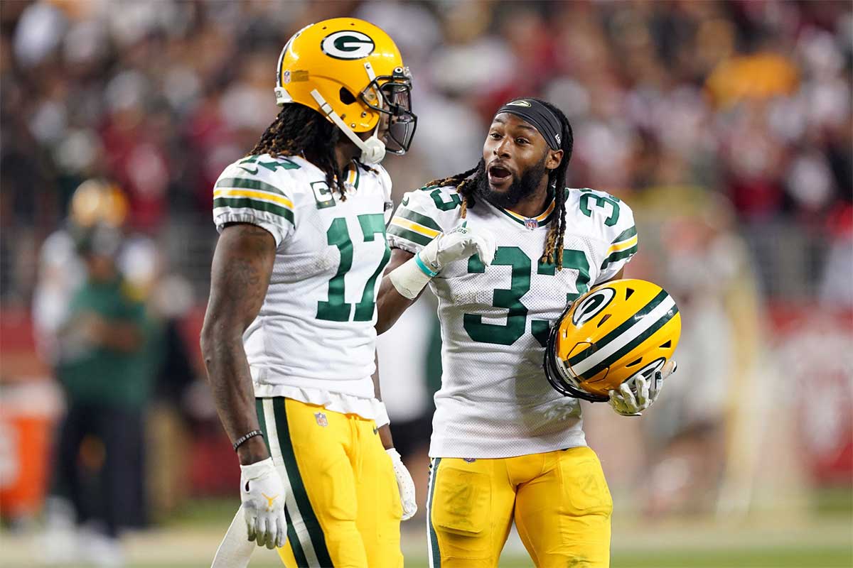 Green Bay Packers running back Aaron Jones (33) talks to wide receiver Davante Adams (17) during the fourth quarter against the San Francisco 49ers at Levi's Stadium.