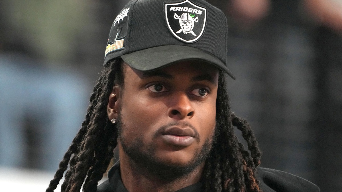Las Vegas Raiders receiver Davante Adams watches from the sidelines during the Pac-12 Championship at Allegiant Stadium.