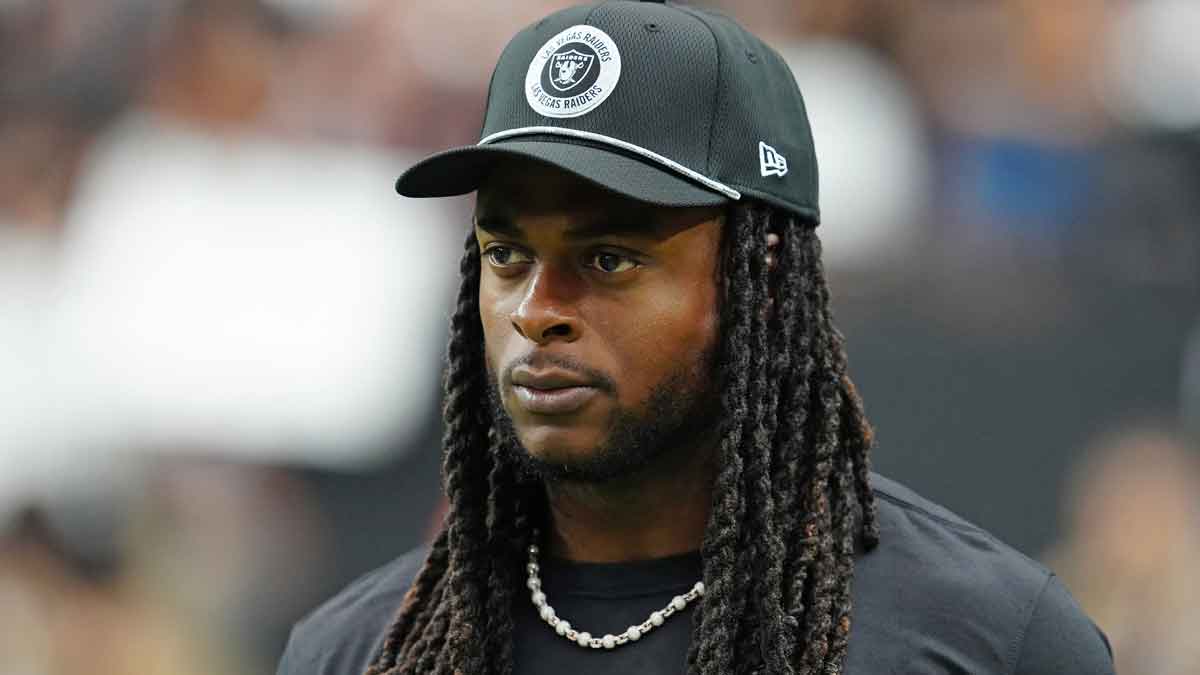 Las Vegas Raiders wide receiver Davante Adams (17) walks the sideline before the start of a game between the Raiders and the Cleveland Browns at Allegiant Stadium. 