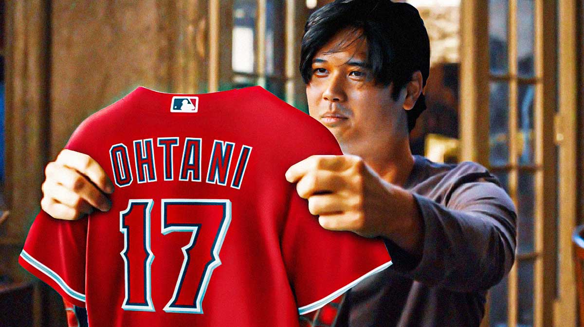 Dodgers' Shohei Ohtani holding his Angels uniform like the pic from Spider-Man 3 below, with Dave Roberts looking on