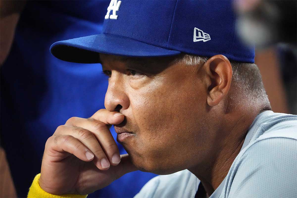 Los Angeles Dodgers manager Dave Roberts (30) looks on against the Arizona Diamondbacks during the first inning at Chase Field.