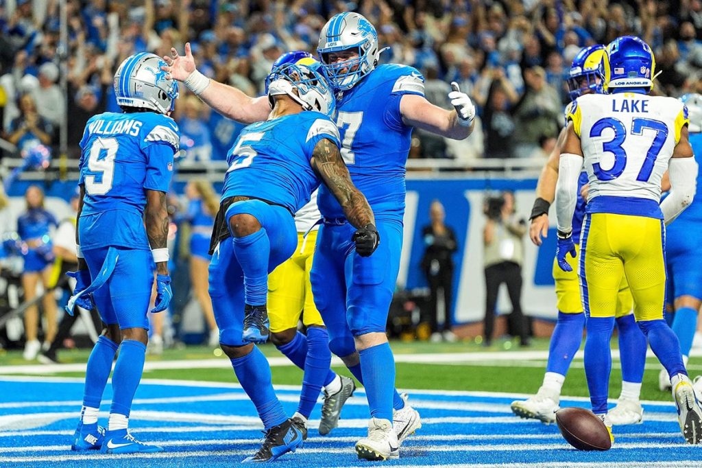 Detroit Lions running back David Montgomery (5) celebrates a touchdown against Los Angeles Rams during overtime at Ford Field in Detroit on Sunday, September 8, 2024.