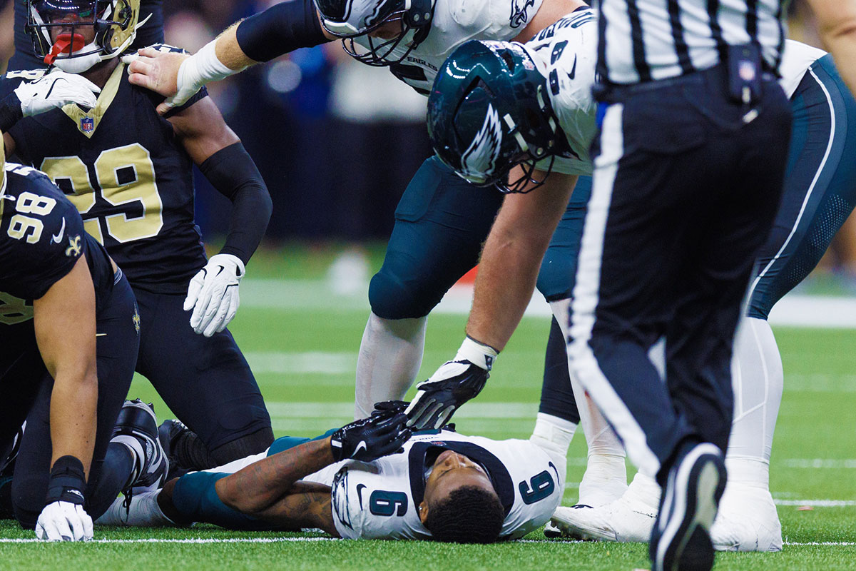 Philadelphia Eagles wide receiver DeVonta Smith (6) is injured on a tackle by New Orleans Saints defensive tackle Khristian Boyd (97) during the second half at Caesars Superdome.