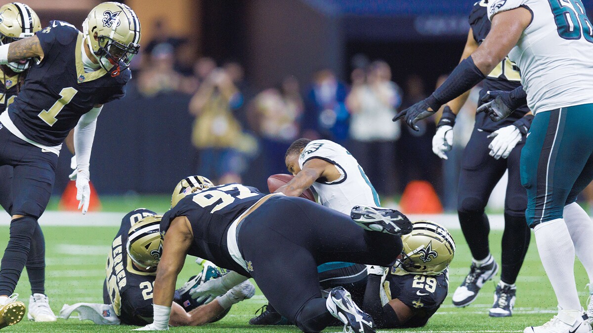 Philadelphia Eagles wide receiver DeVonta Smith (6) is injured on a tackle by New Orleans Saints defensive tackle Khristian Boyd (97) during the second half at Caesars Superdome.