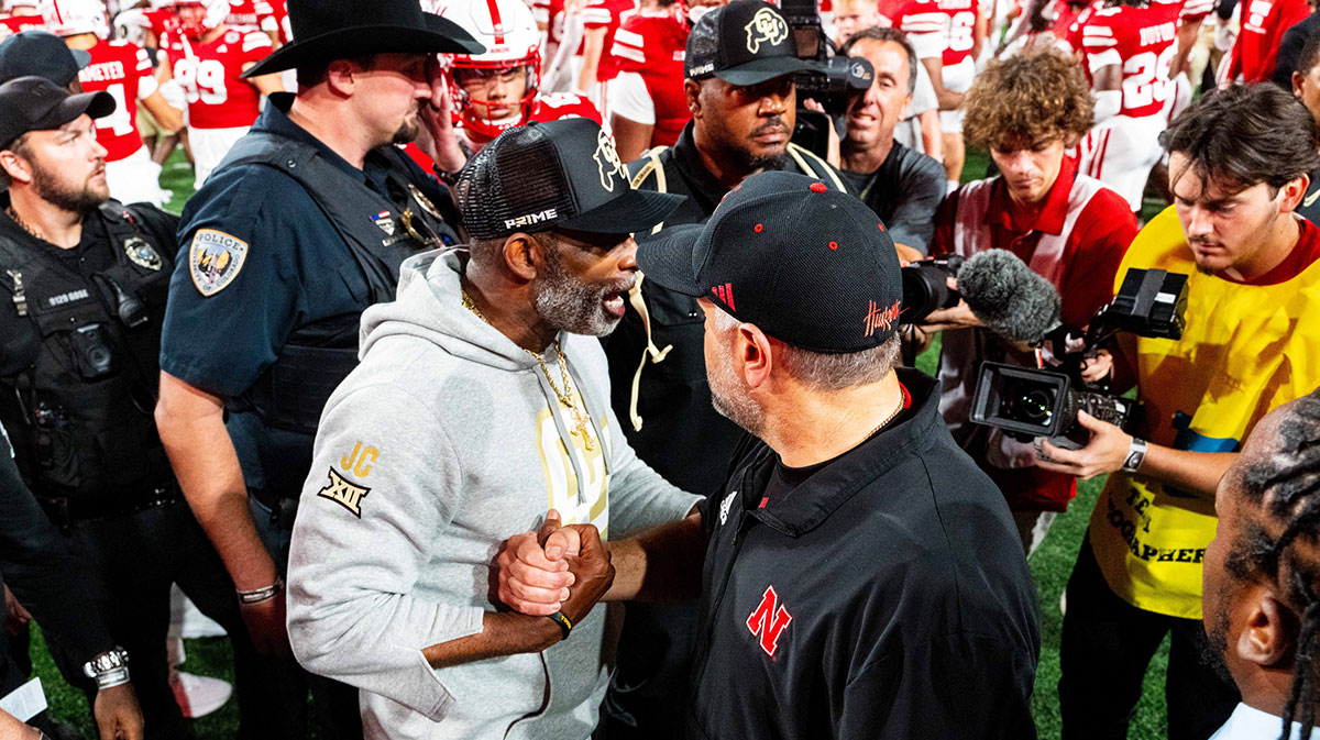 Colorado Buffaloes head coach Deion Sanders and Nebraska Cornhuskers head coach Matt Rhule shake hands after the Cornhuskers defeat the Buffaloes at Memorial Stadium.