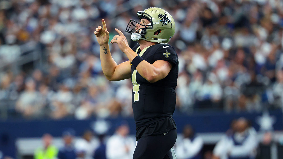 New Orleans Saints quarterback Derek Carr (4) reacts after a touchdown during the second half against the Dallas Cowboys at AT&T Stadium.