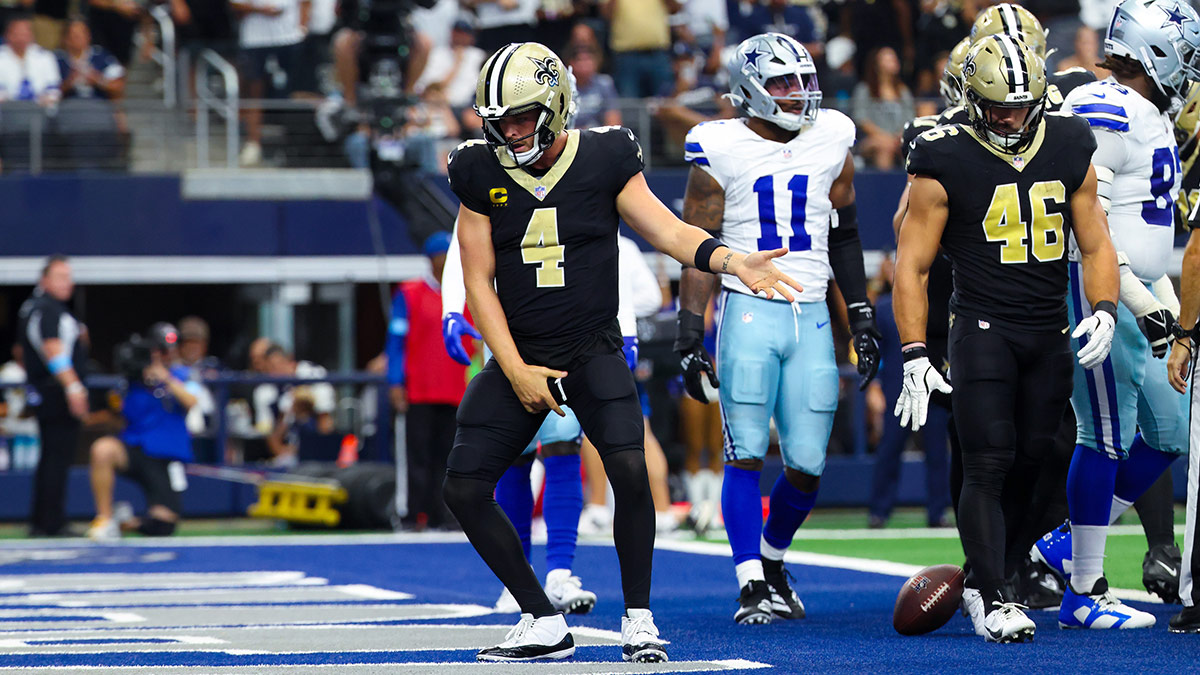 New Orleans Saints quarterback Derek Carr (4) celebrates after scoring a touchdown during the first half against the Dallas Cowboys at AT&T Stadium. 