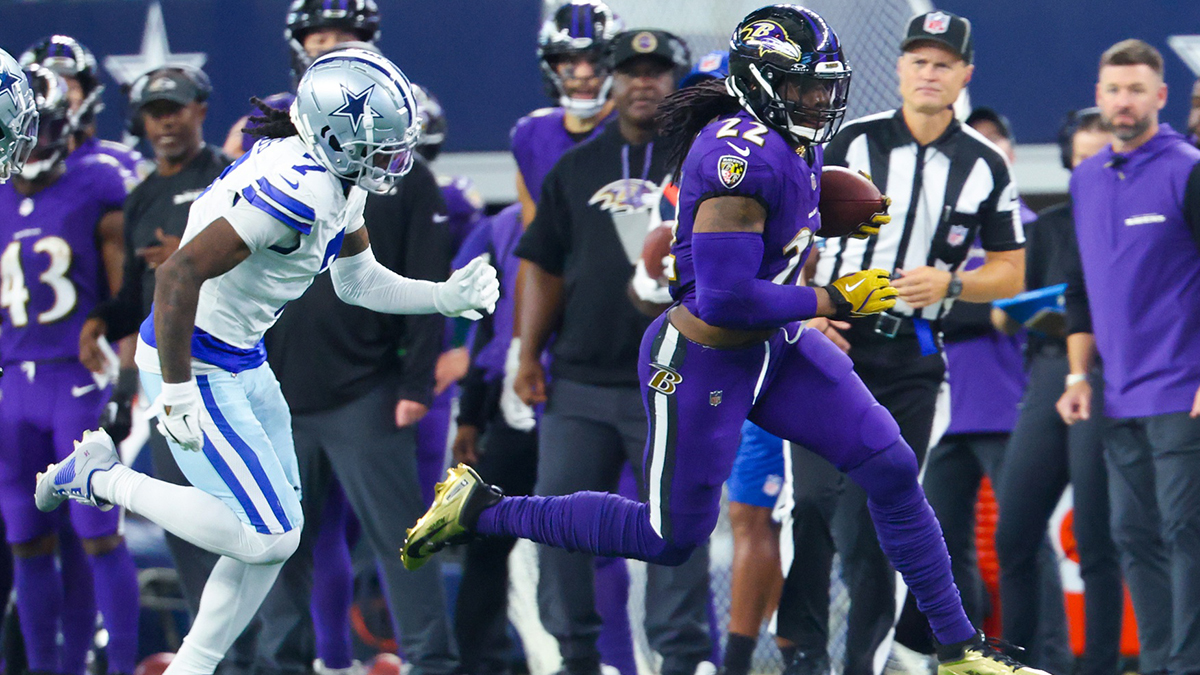 Baltimore Ravens running back Derrick Henry (22) runs with the ball as Dallas Cowboys cornerback Trevon Diggs (7) chases during the second half at AT&T Stadium.