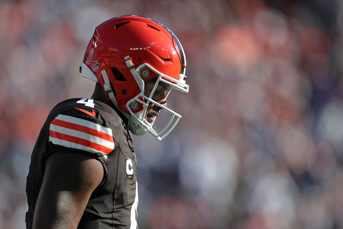 Cleveland Browns quarterback Deshaun Watson (4) hangs his head as he walks off the field during the first half of an NFL football game