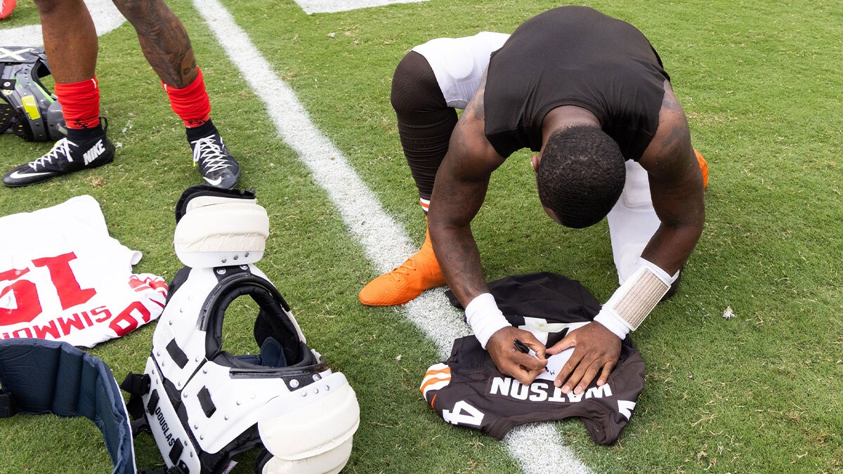 Cleveland Browns quarterback Deshaun Watson (4) signs his jersey after the game against the New York Giants at Huntington Bank Field.