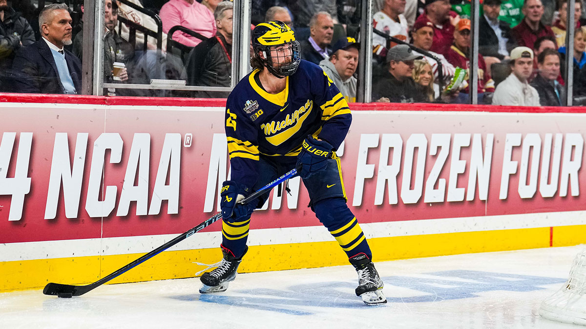Michigan Wolverines defenseman Seamus Casey (26) looks to pass in the semifinals of the 2024 Frozen Four college ice hockey tournament during the second period against the Boston College Eagles at Xcel Energy Center.