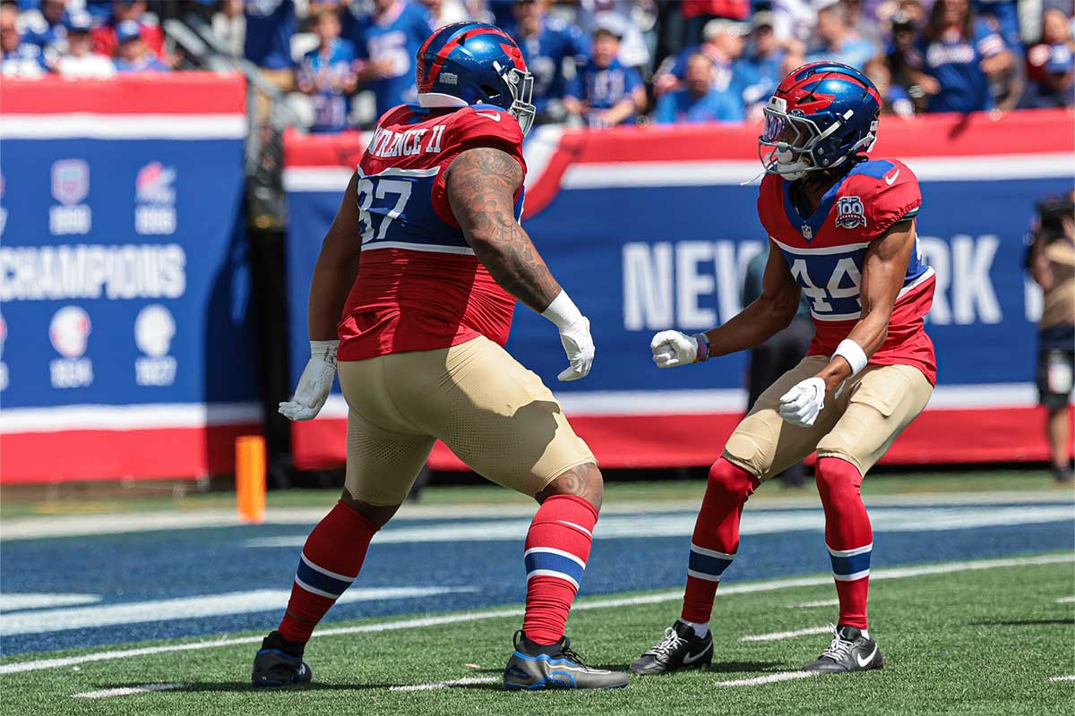 Sep 8, 2024; East Rutherford, New Jersey, USA; New York Giants defensive tackle Dexter Lawrence II (97) celebrates his sack with cornerback Nick McCloud (44) during the first quarter against the Minnesota Vikings at MetLife Stadium.