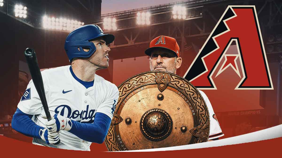 Torey Lovullo holding a shield, while protecting the Diamondbacks logo, with Dodgers' Freddie Freeman trying to smash the shield with a bat