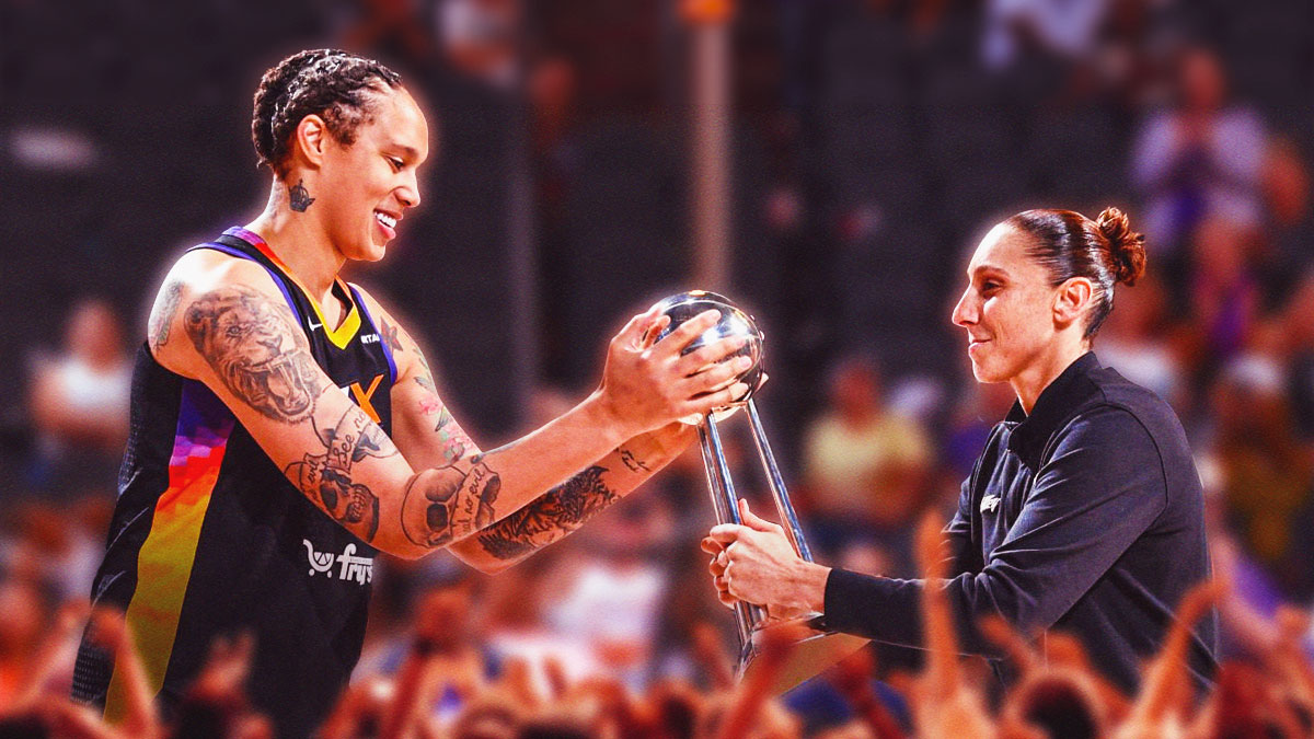 Phoenix Mercury center Brittney Griner and guard Diana Taurasi, both smiling and holding the WNBA Championship Trophy.