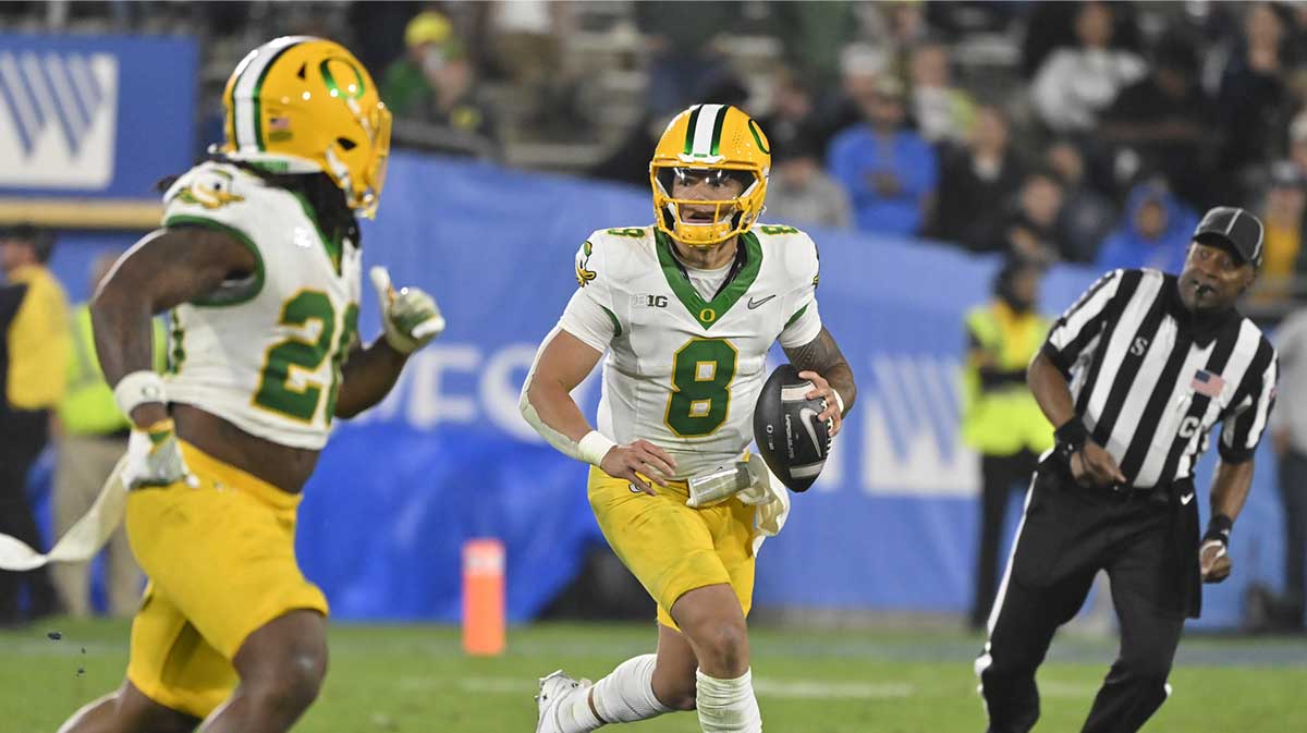 Oregon Ducks quarterback Dillon Gabriel (8) scrambles during the third quarter against the UCLA Bruins at Rose Bowl.