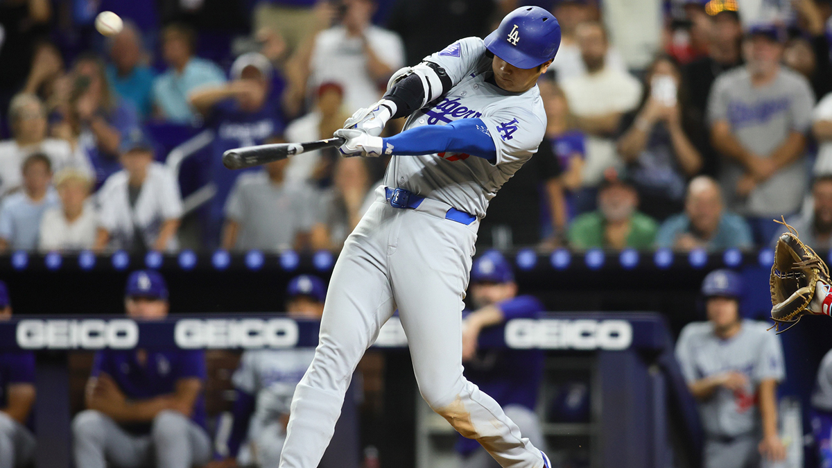 Los Angeles Dodgers designated hitter Shohei Ohtani (17) hits a three-run home run against the Miami Marlins during the ninth inning at loanDepot Park.