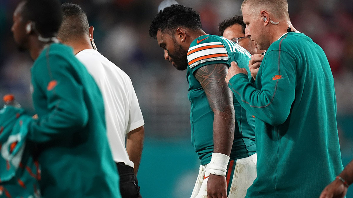 Sep 12, 2024; Miami Gardens, Florida, USA; Miami Dolphins quarterback Tua Tagovailoa (1) walks off the field with training staff after an apparent injury during the second half against the Buffalo Bills at Hard Rock Stadium.