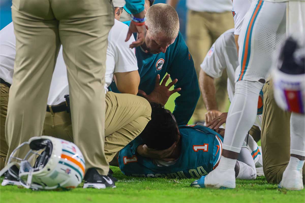 Miami Dolphins quarterback Tua Tagovailoa (1) is checked on by trainers after an apparent injury against the Buffalo Bills during the third quarter at Hard Rock Stadium.