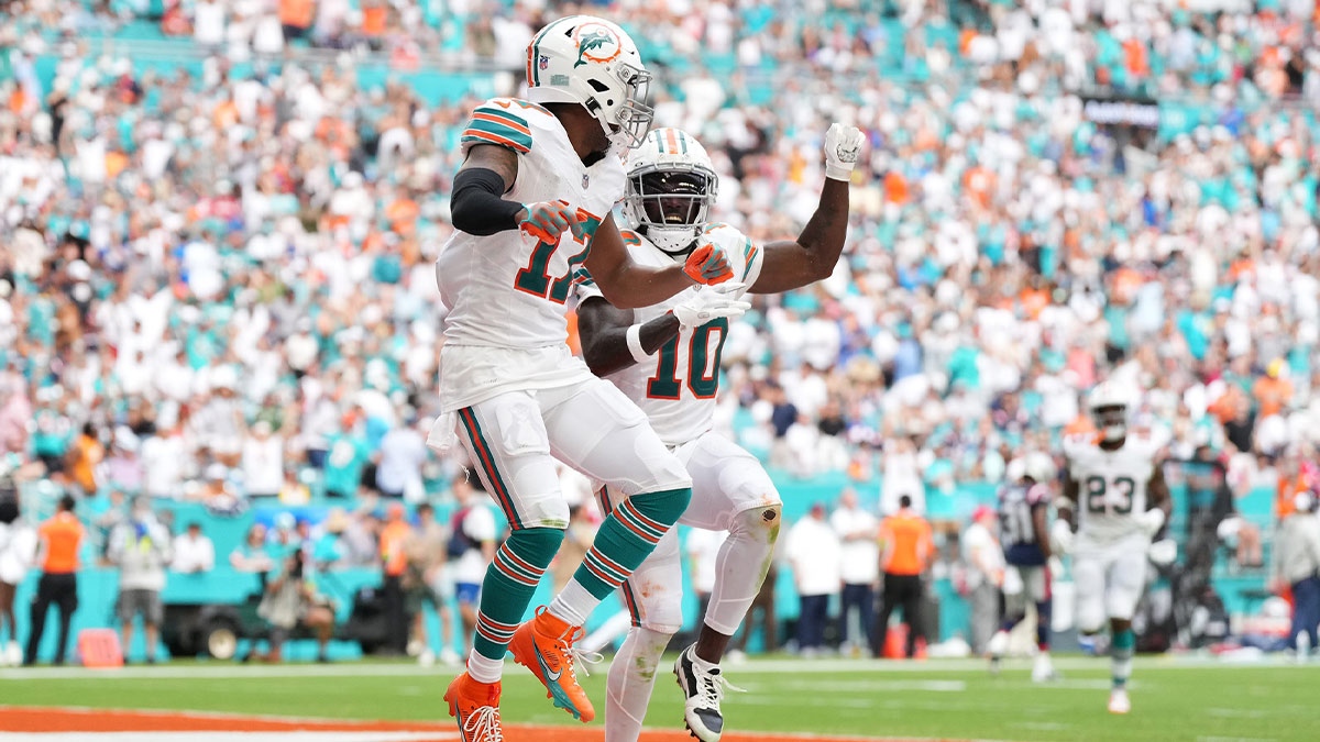 Miami Dolphins wide receiver Jaylen Waddle (17) celebrates his touchdown against the New England Patriots with wide receiver Tyreek Hill (10) during the second half at Hard Rock Stadium.